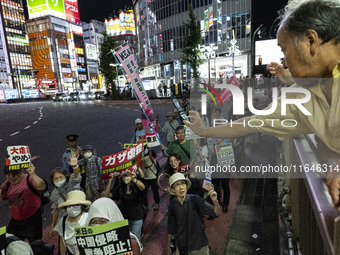 Pro-Palestinian people march through downtown in Tokyo, Japan, on October 7, during the protest against Israeli military actions in Gaza, 20...