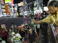 Pro-Palestinian people march through downtown in Tokyo, Japan, on October 7, during the protest against Israeli military actions in Gaza, 20...