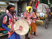 Tribal community people who work in the tea garden collect donations for the upcoming 'Dashai Puja,' which is celebrated during the Dusshera...