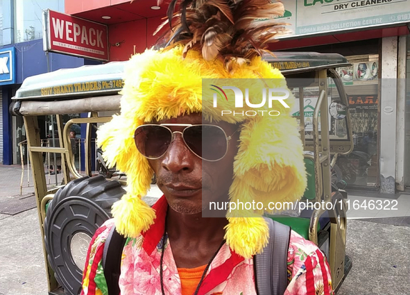 Tribal community people who work in the tea garden collect donations for the upcoming 'Dashai Puja,' which is celebrated during the Dusshera...