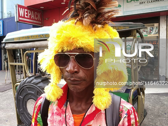 Tribal community people who work in the tea garden collect donations for the upcoming 'Dashai Puja,' which is celebrated during the Dusshera...