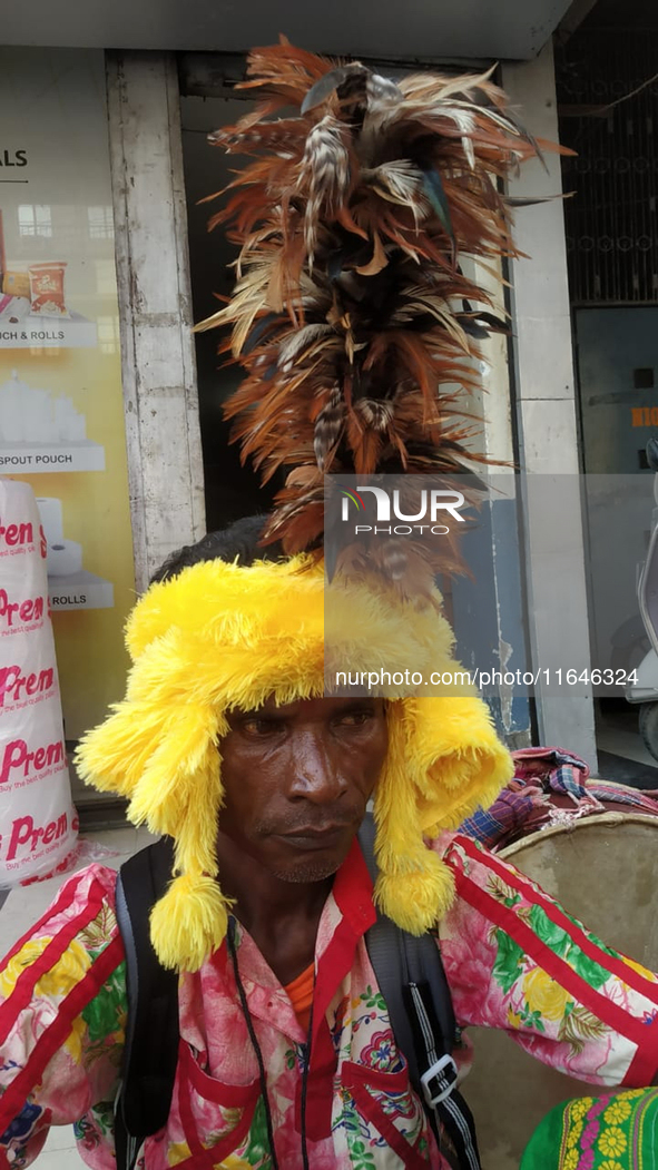 Tribal community people who work in the tea garden collect donations for the upcoming 'Dashai Puja,' which is celebrated during the Dusshera...