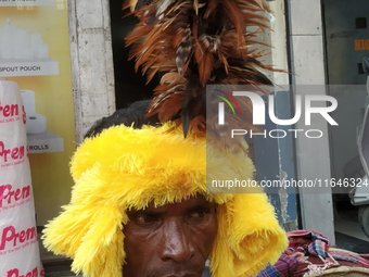 Tribal community people who work in the tea garden collect donations for the upcoming 'Dashai Puja,' which is celebrated during the Dusshera...