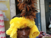 Tribal community people who work in the tea garden collect donations for the upcoming 'Dashai Puja,' which is celebrated during the Dusshera...