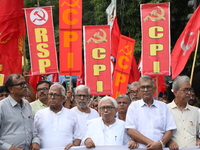 The Communist Party of India (Marxist), West Bengal, holds posters and shouts slogans during a protest march amid the ongoing conflict in Ga...