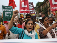 The Communist Party of India (Marxist), West Bengal, holds posters and shouts slogans during a protest march amid the ongoing conflict in Ga...