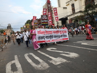 The Communist Party of India (Marxist), West Bengal, holds posters and shouts slogans during a protest march amid the ongoing conflict in Ga...