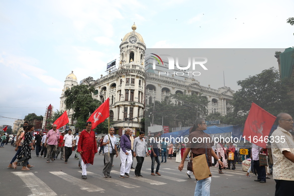 The Communist Party of India (Marxist), West Bengal, holds posters during a protest amid the ongoing conflict in Gaza between Israel and Ham...