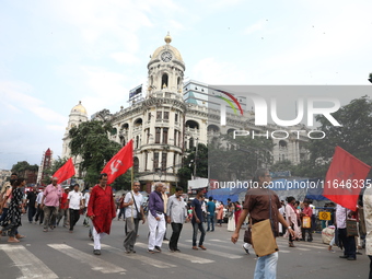 The Communist Party of India (Marxist), West Bengal, holds posters during a protest amid the ongoing conflict in Gaza between Israel and Ham...