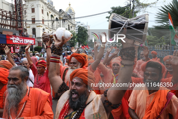 Sadhus or Hindu holy men participate in a protest near a stage where junior doctors hold a hunger strike to protest against the rape and mur...