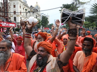 Sadhus or Hindu holy men participate in a protest near a stage where junior doctors hold a hunger strike to protest against the rape and mur...