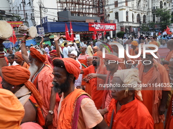 Sadhus or Hindu holy men participate in a protest near a stage where junior doctors hold a hunger strike to protest against the rape and mur...