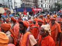 Sadhus or Hindu holy men participate in a protest near a stage where junior doctors hold a hunger strike to protest against the rape and mur...