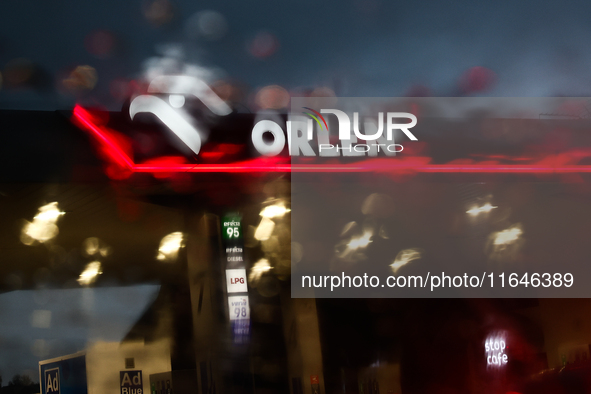 Orlen logo is seen through the raindrops on the car window at a gas station Poland on October 6, 2024. 