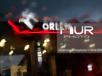 Orlen logo is seen through the raindrops on the car window at a gas station Poland on October 6, 2024. (