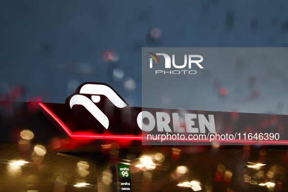 Orlen logo is seen through the raindrops on the car window at a gas station Poland on October 6, 2024. 