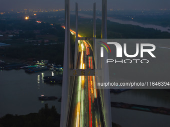 A large number of vehicles return on a highway in Huai'an, China, on October 7, 2024. (