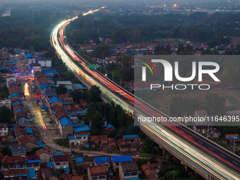 A large number of vehicles return on a highway in Huai'an, China, on October 7, 2024. (