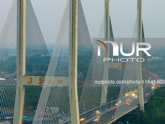 A large number of vehicles return on a highway in Huai'an, China, on October 7, 2024. (