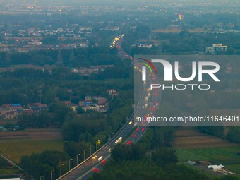 A large number of vehicles return on a highway in Huai'an, China, on October 7, 2024. (