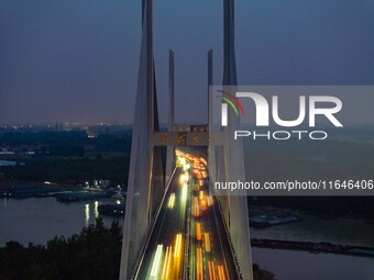 A large number of vehicles return on a highway in Huai'an, China, on October 7, 2024. (