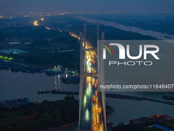 A large number of vehicles return on a highway in Huai'an, China, on October 7, 2024. (