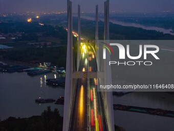 A large number of vehicles return on a highway in Huai'an, China, on October 7, 2024. (