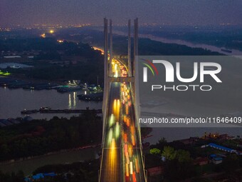 A large number of vehicles return on a highway in Huai'an, China, on October 7, 2024. (