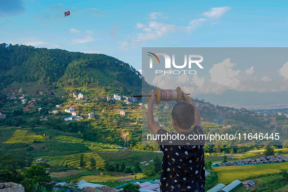 Kids fly kites on the occasion of the Dashain festival in the outskirts of Kathmandu, Nepal, on October 7, 2024. 