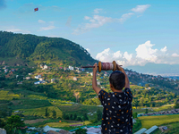 Kids fly kites on the occasion of the Dashain festival in the outskirts of Kathmandu, Nepal, on October 7, 2024. (