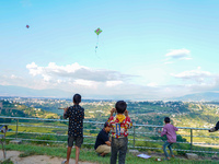 Kids fly kites on the occasion of the Dashain festival in the outskirts of Kathmandu, Nepal, on October 7, 2024. (