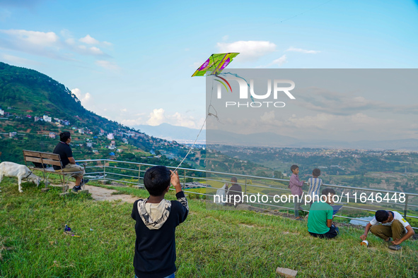 Kids fly kites on the occasion of the Dashain festival in the outskirts of Kathmandu, Nepal, on October 7, 2024. 