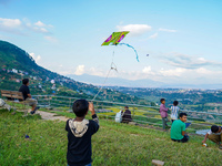 Kids fly kites on the occasion of the Dashain festival in the outskirts of Kathmandu, Nepal, on October 7, 2024. (