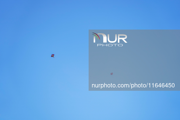 Kids fly kites on the occasion of the Dashain festival in the outskirts of Kathmandu, Nepal, on October 7, 2024. 