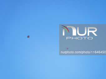 Kids fly kites on the occasion of the Dashain festival in the outskirts of Kathmandu, Nepal, on October 7, 2024. (