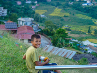 Kids fly kites on the occasion of the Dashain festival in the outskirts of Kathmandu, Nepal, on October 7, 2024. (