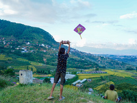 Kids fly kites on the occasion of the Dashain festival in the outskirts of Kathmandu, Nepal, on October 7, 2024. (