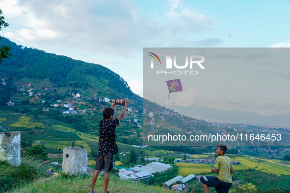 Kids fly kites on the occasion of the Dashain festival in the outskirts of Kathmandu, Nepal, on October 7, 2024. 