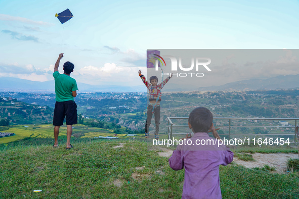 Kids fly kites on the occasion of the Dashain festival in the outskirts of Kathmandu, Nepal, on October 7, 2024. 