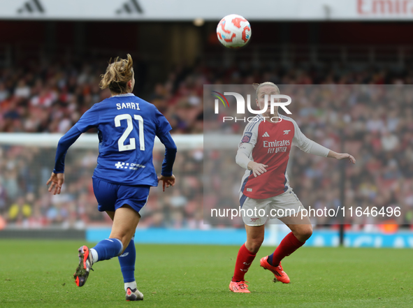 Everton's Veatriki and Arsenal's Kim Little eye the ball during the Barclays FA Women's Super League match between Arsenal and Everton at th...