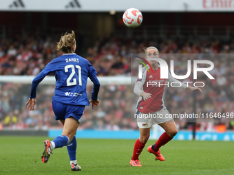 Everton's Veatriki and Arsenal's Kim Little eye the ball during the Barclays FA Women's Super League match between Arsenal and Everton at th...