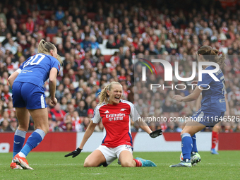 Frida Maanum of Arsenal goes down after pulling her groin during the Barclays FA Women's Super League match between Arsenal and Everton at t...