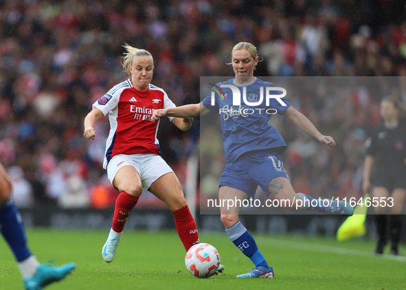 Beth Mead of Arsenal and Everton's Lucy Hope participate in the Barclays FA Women's Super League match between Arsenal and Everton at the Em...