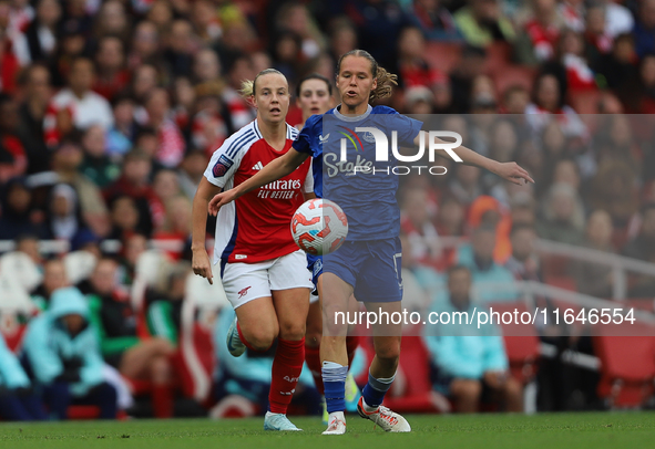 Caroline Olsen of Everton beats Arsenal's Beth Mead to the ball during the Barclays FA Women's Super League match between Arsenal and Everto...