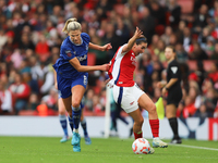 Justine Vanhavermaet of Everton pulls Mariona Caldentey of Arsenal's shirt during the Barclays FA Women's Super League match between Arsenal...