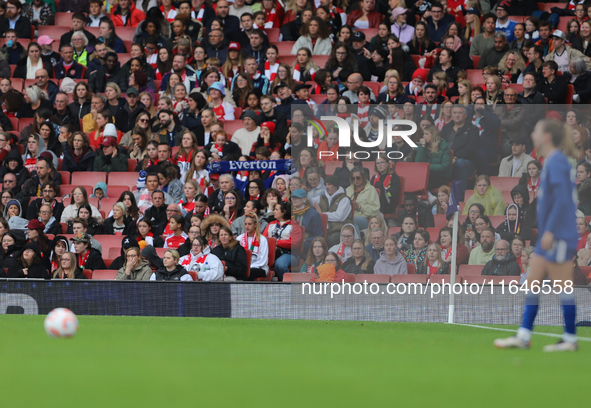 An Everton fan holds up a scarf in the Arsenal home end before an Everton free kick during the Barclays FA Women's Super League match betwee...