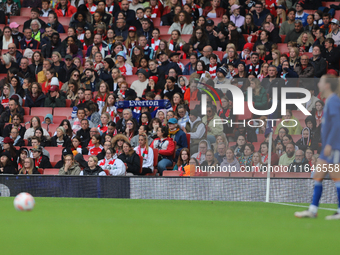 An Everton fan holds up a scarf in the Arsenal home end before an Everton free kick during the Barclays FA Women's Super League match betwee...