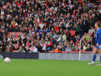 An Everton fan holds up a scarf in the Arsenal home end before an Everton free kick during the Barclays FA Women's Super League match betwee...