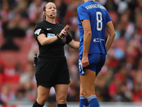 Referee Stacey Pearson speaks with Justine Vanhavermaet of Everton during the Barclays FA Women's Super League match between Arsenal and Eve...