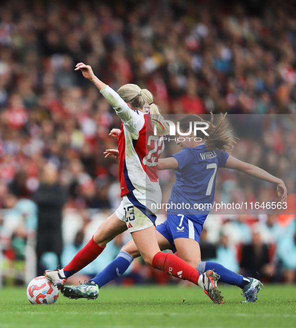 Arsenal's Alessia Russo and Everton's Clare Wheeler participate in the Barclays FA Women's Super League match between Arsenal and Everton at...